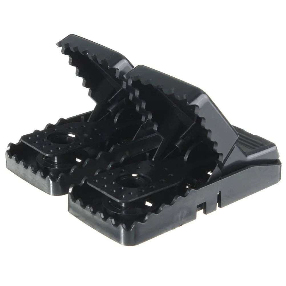 Six black snapping mousetraps showing PC+ABS alloy plastic construction and biting mechanism