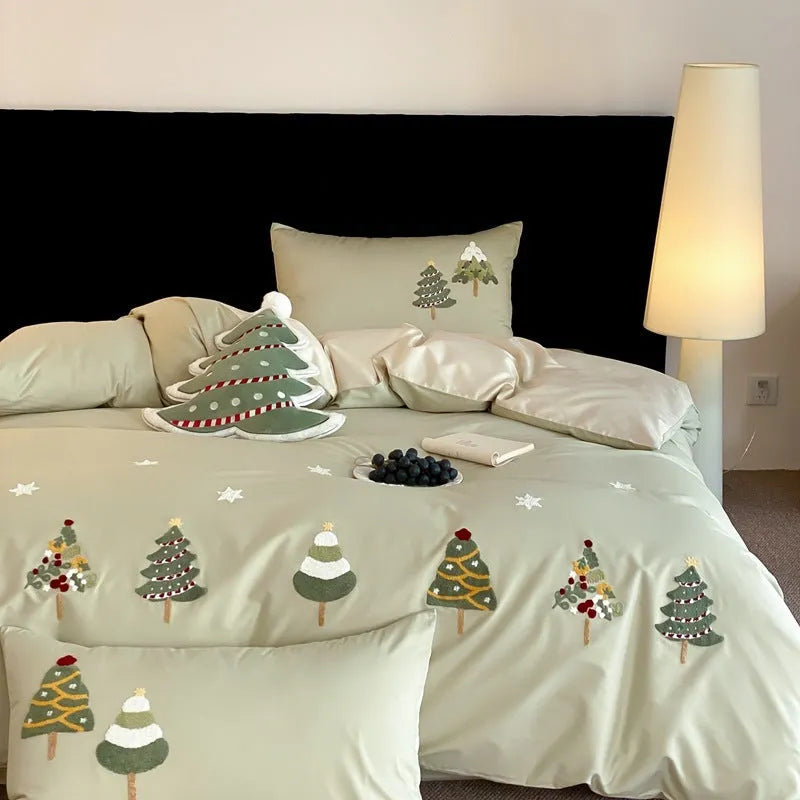 Cream Blue cotton duvet cover with embroidered Christmas tree and flower design, part of a four-piece bedding set.