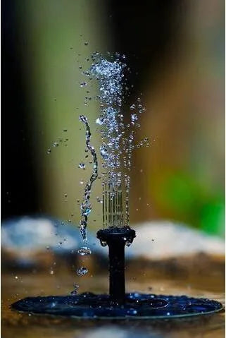 Black solar-powered floating water fountain pump with four spray nozzles on a 16cm square base.