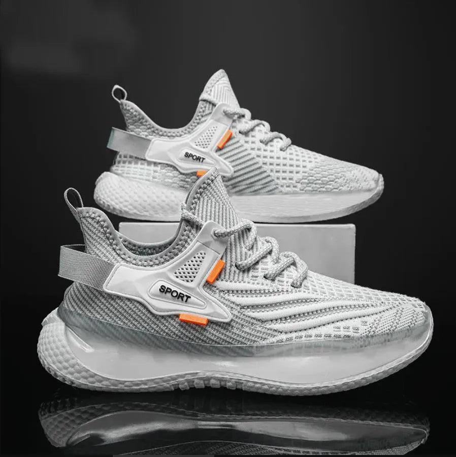 Men's low-top casual sneaker in woven mesh with a round toe and flat rubber sole.