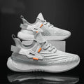Men's low-top casual sneaker in woven mesh with a round toe and flat rubber sole.
