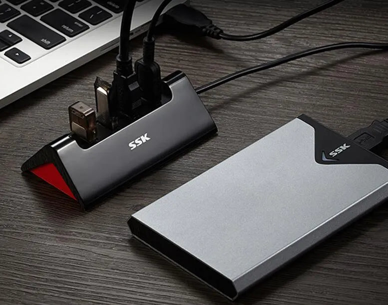 Black USB expansion dock with four USB ports showing compact dimensions