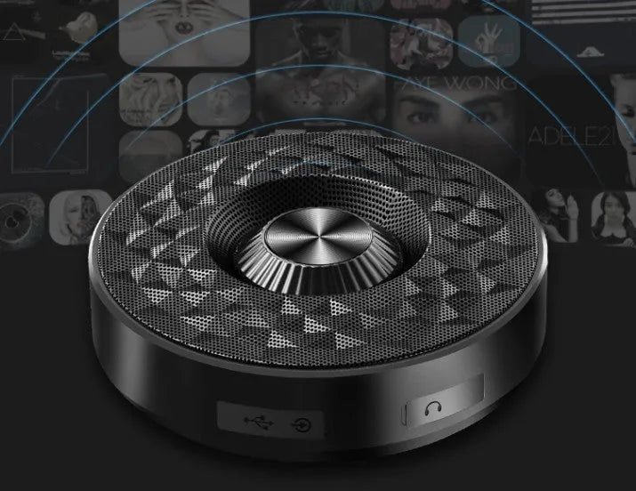 Compact black Bluetooth speaker showing front grill and controls.