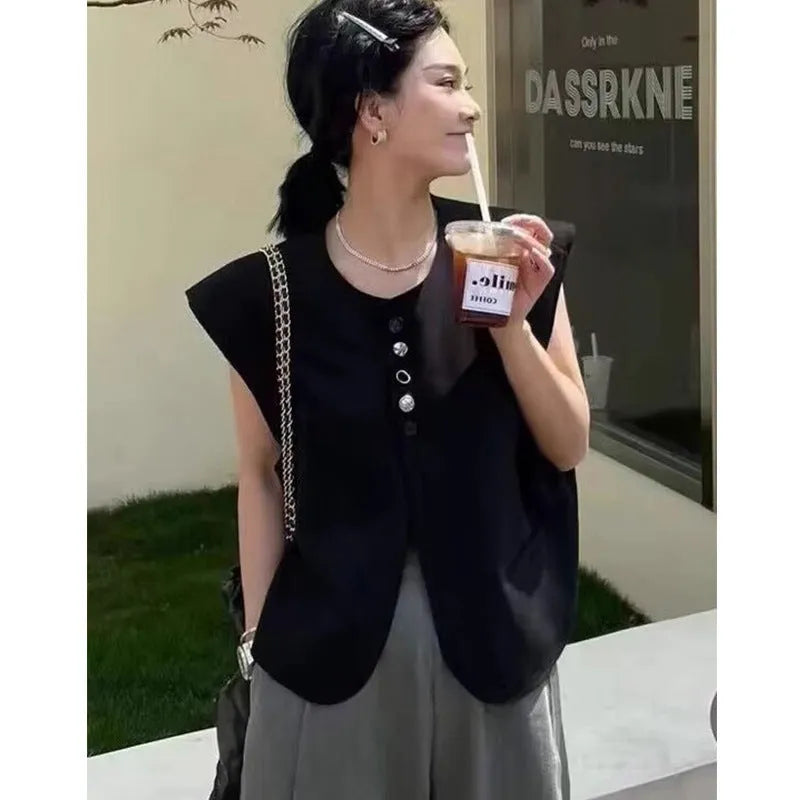Women's short-length polyester vest in milky white, showing loose fit and front pockets