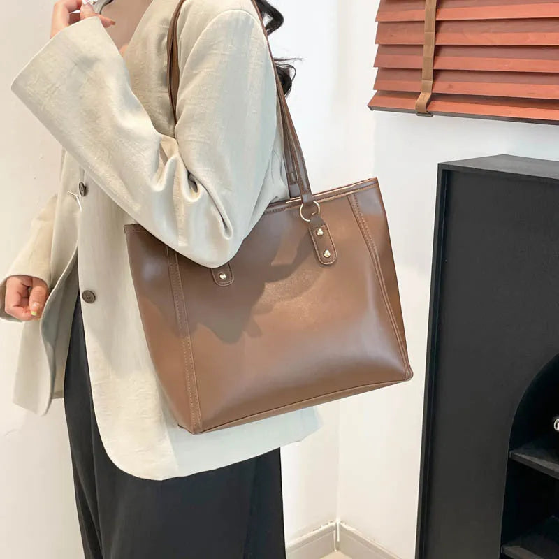 Korean style horizontal square shoulder underarm bag in PU with sandwich pocket, shown in beige colour.