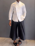 White asymmetric front shirt with black pleated trousers casual co-ord set