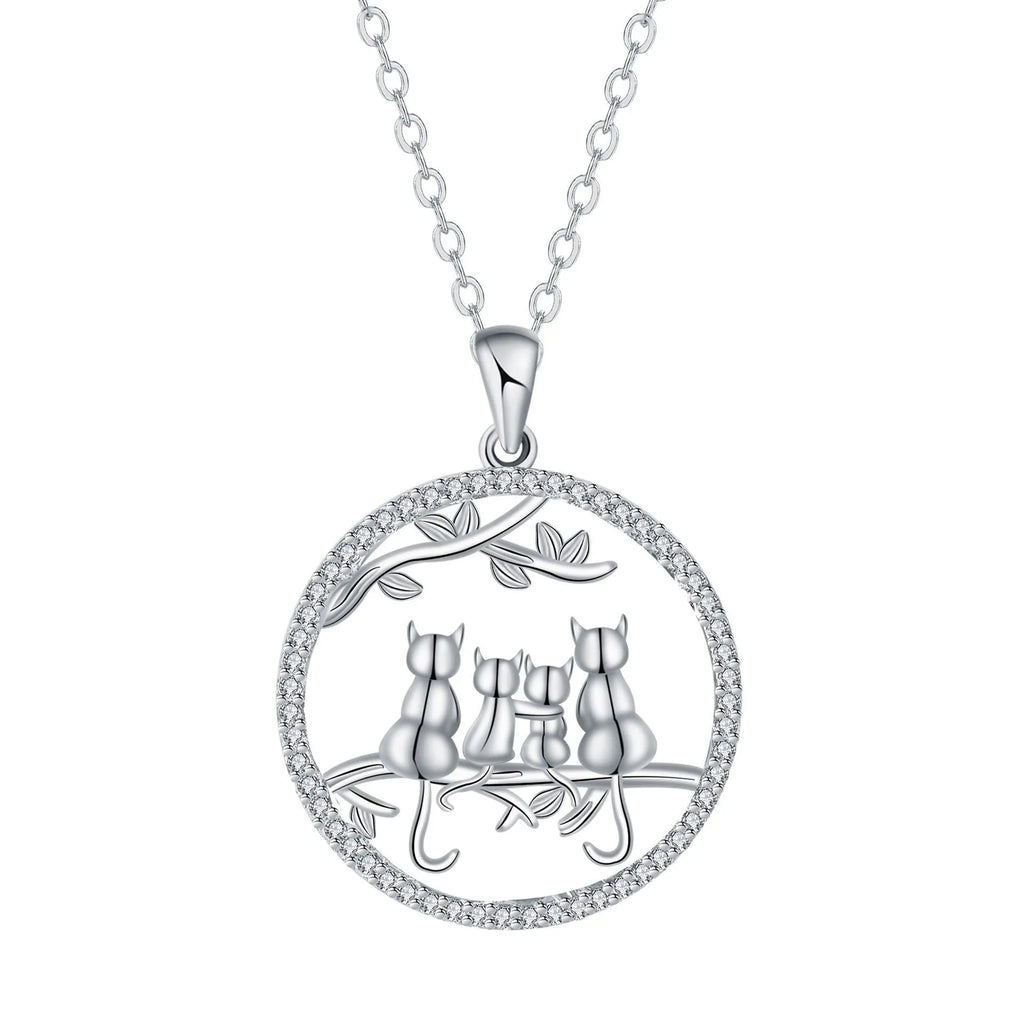 Women's copper necklace with an electroplated pendant showing four kittens on a cross chain.
