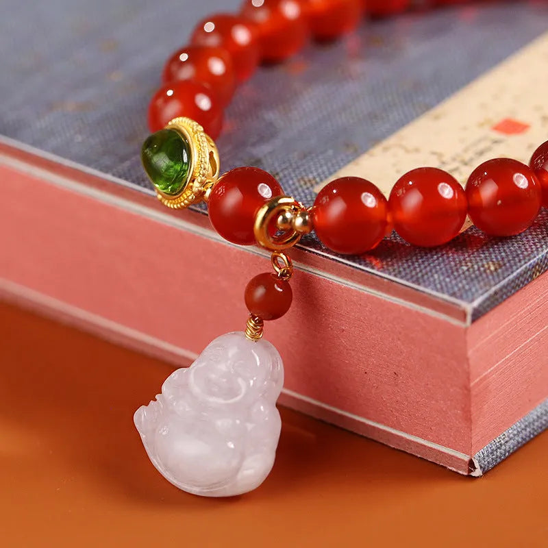 Handcrafted natural agate bracelet with red beads, amber geometric elements, and Maitreya Buddha charm