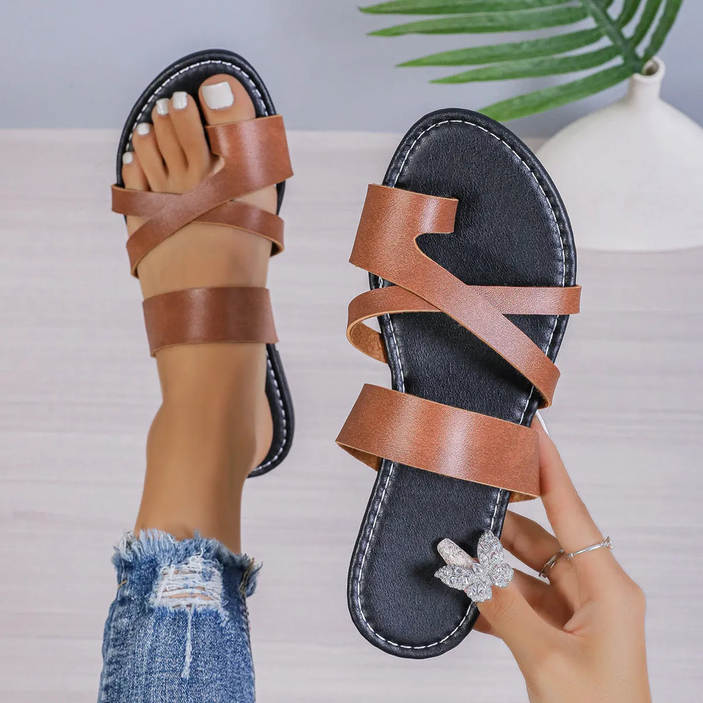 Casual round head beach slippers with a hollow out PU upper and leather lining.