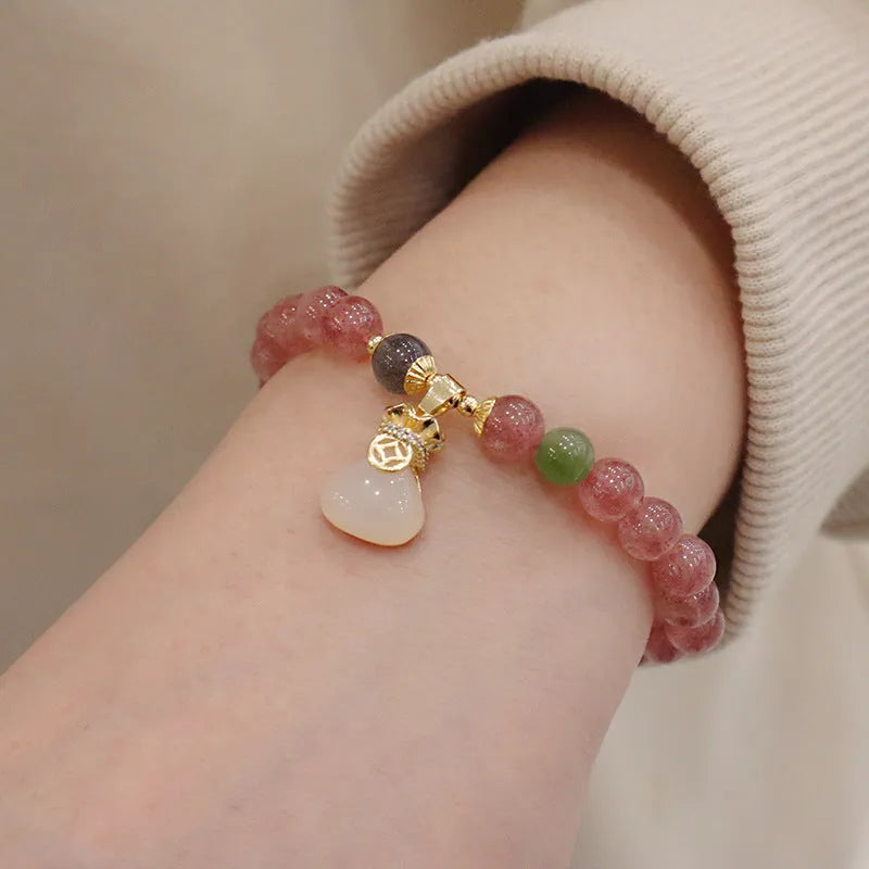 Strawberry quartz bracelet with Chinese purse charm and Hetian jade accents