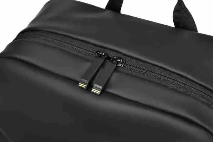 Large waterproof PU leather backpack for men with visible stitching details in black colour