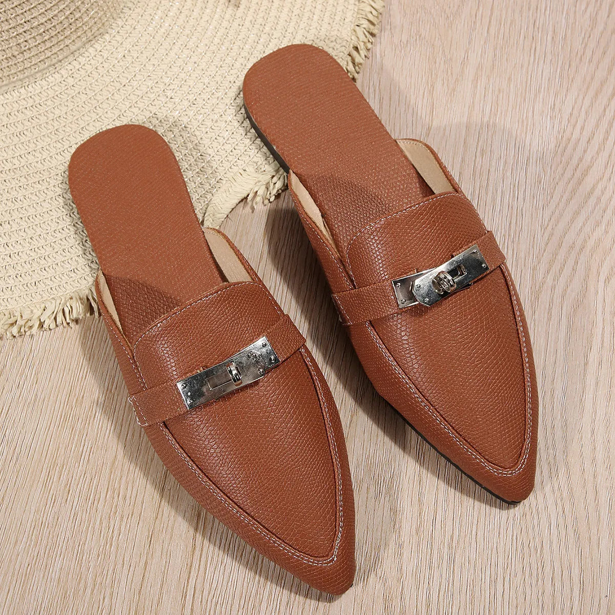Light brown women's pointed toe low heel semi-slippers with a PU upper and rubber sole.