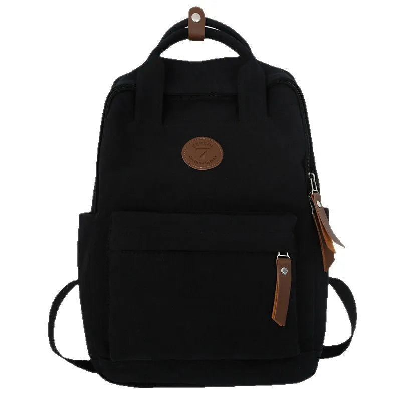Black Oxford cloth backpack with curved shoulder straps and urban simplicity design