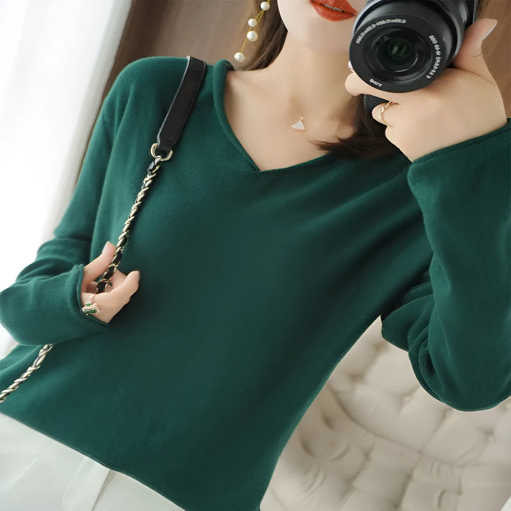 Women's V-neck long sleeve knit top in a macaron colour on a hanger.