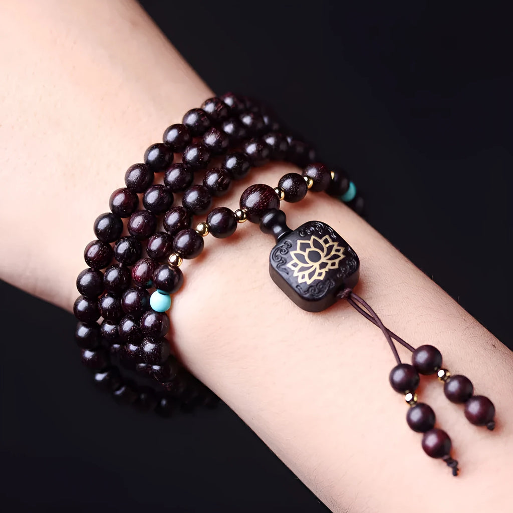DIY kit showing 108 small 0.6 cm Zambia Rosewood beads for making a flat lotus pendant Buddha bead bracelet.