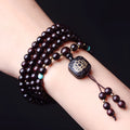 DIY kit showing 108 small 0.6 cm Zambia Rosewood beads for making a flat lotus pendant Buddha bead bracelet.