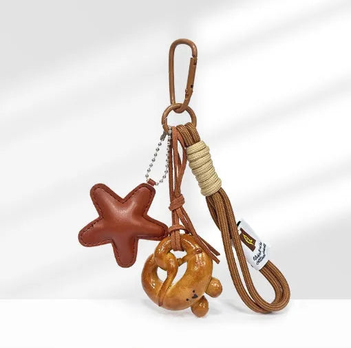 Brown five-pointed star handmade soda bread style handbag pendant with carrying strap