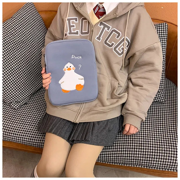 Blue cotton tablet case with embroidered duck design and zipper closure