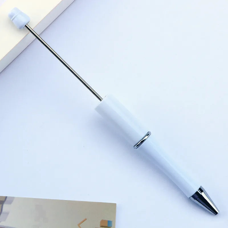 Ballpoint pen with colourful spinning plastic beads on barrel, shown in a gradient purple finish.