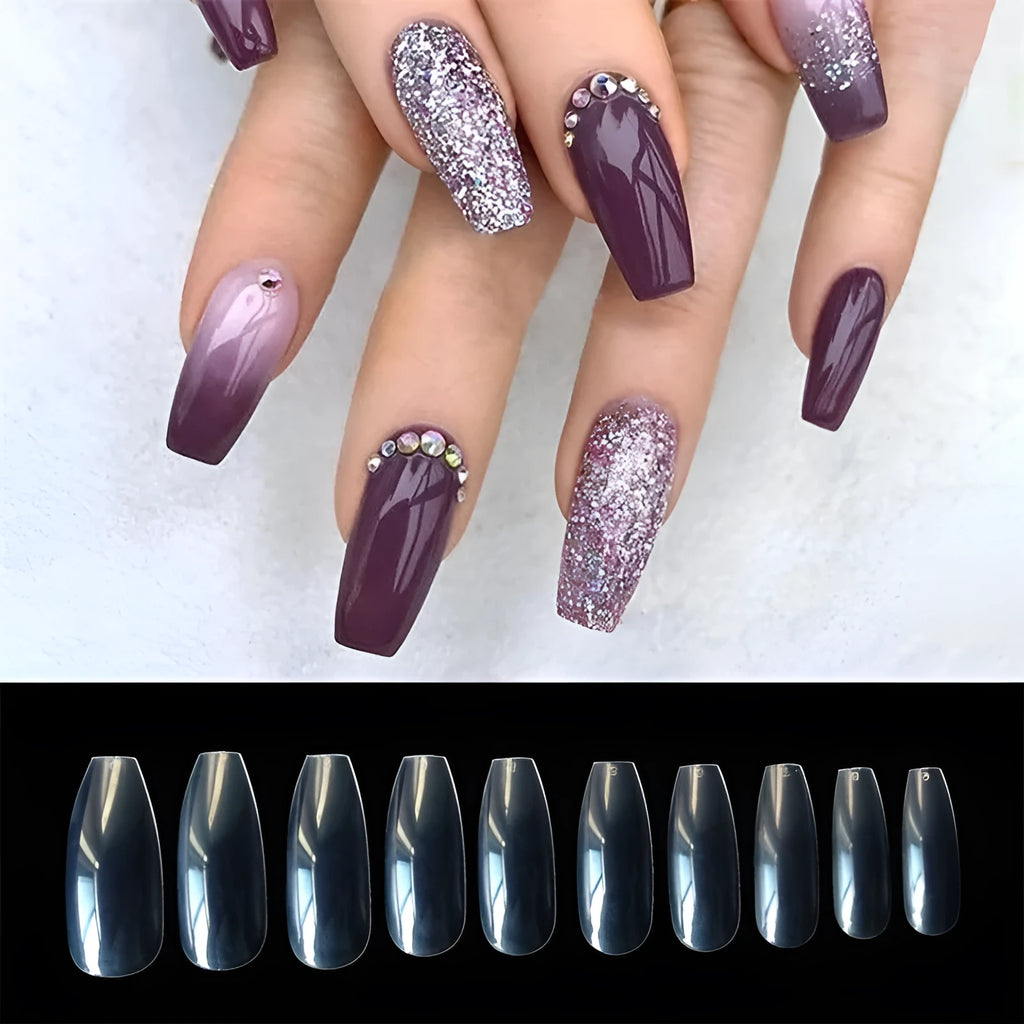 500 clear and natural coloured ABS plastic false nails in ten different sizes arranged on a white surface