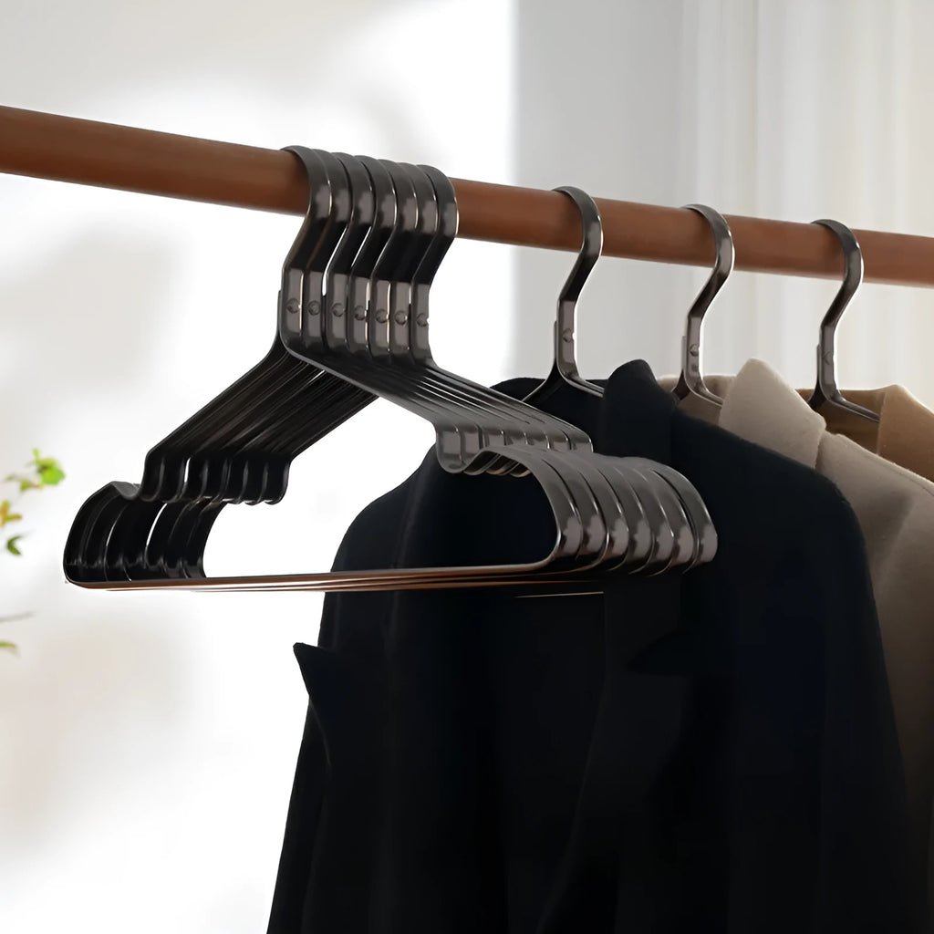 Elegant black metal clothes hanger with anti-slip and anti-rust coating on a white background.