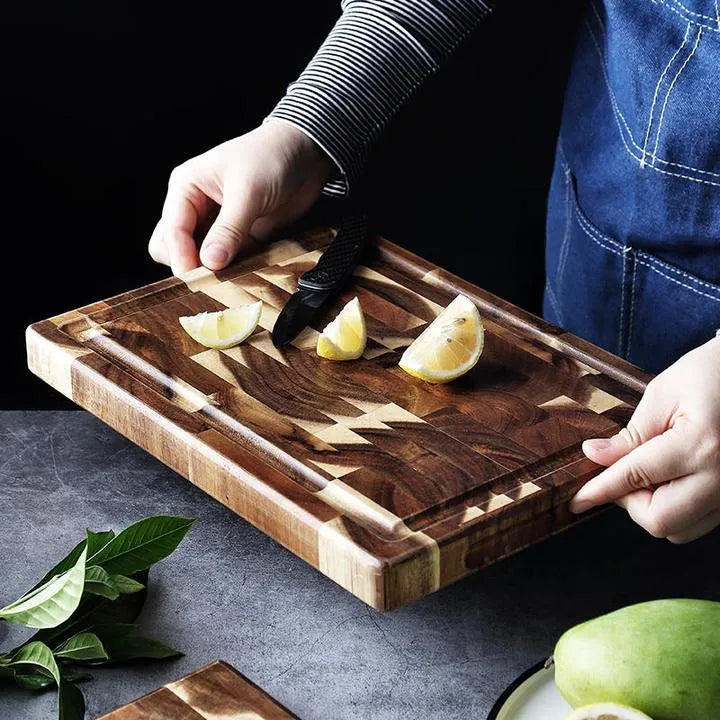 Brown solid acacia wood chopping board, 3cm thick, on a kitchen countertop.