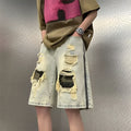 Men's camouflage patterned denim shorts with ripped detailing in yellow colour, straight leg Korean style