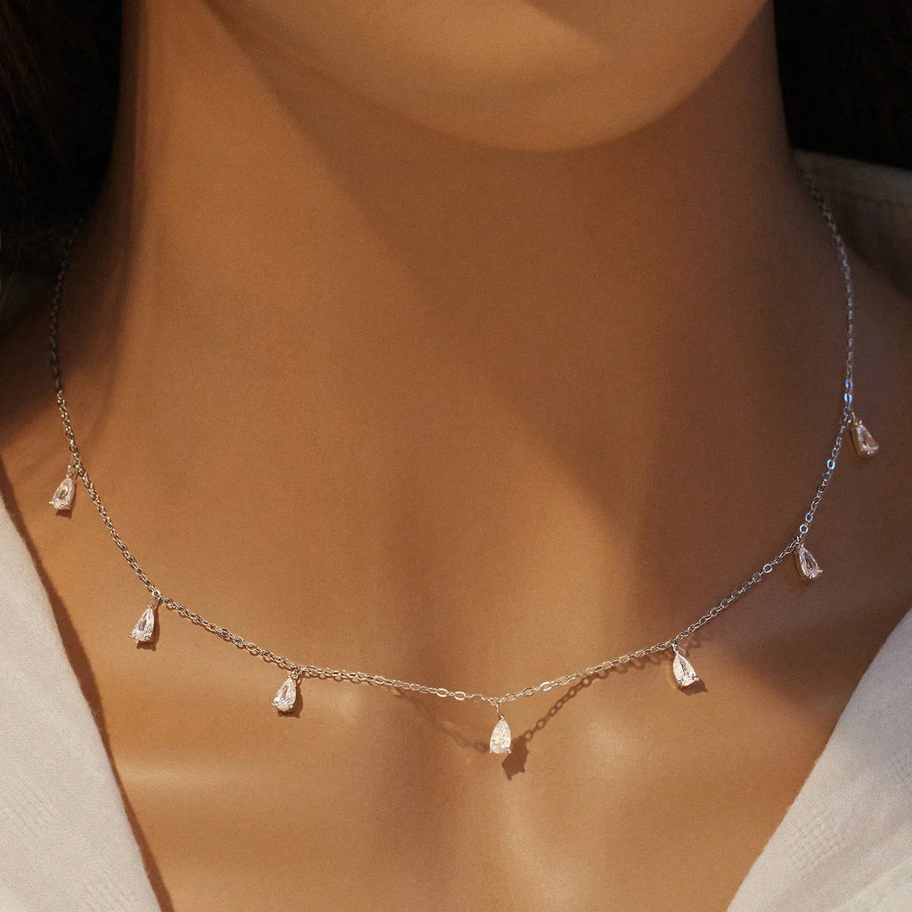Gentle drop-shaped artificial zircon necklace on a silver O-chain, showing silver, rose gold, and golden yellow colour options.