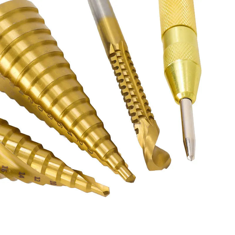 High speed steel step drill bit and centre punch set in metal case with size markings from 3mm to 32mm