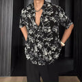 White floral printed casual shirt with short sleeves and loose cardigan-style fit