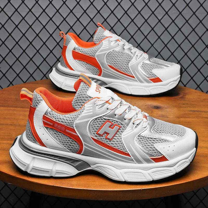 Men's mesh running shoes in black, white and gray, or white orange colours with plastic sole