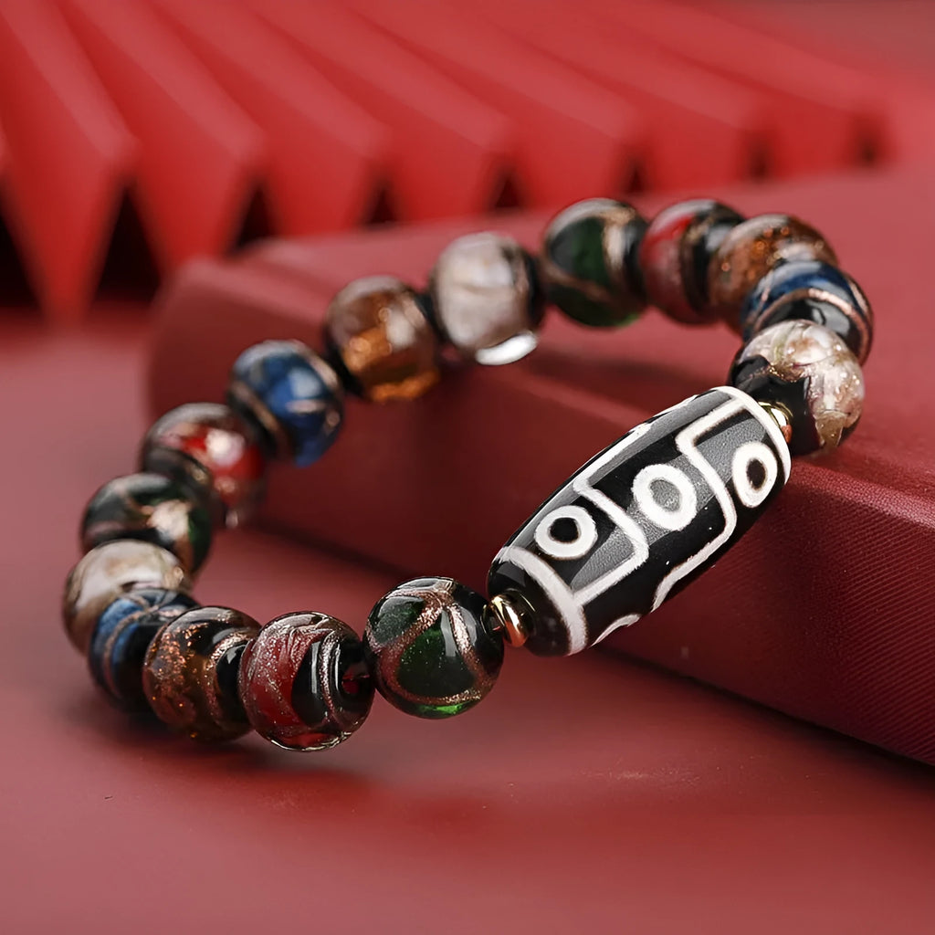 Chinese style lucky bracelet with colourful coloured glaze beads and auspicious patterns.