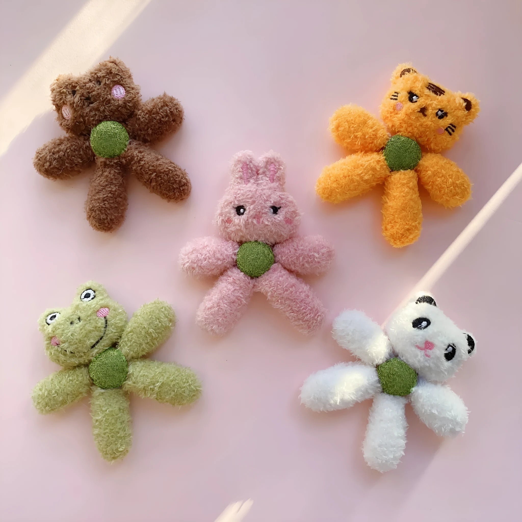 Plush catnip ball chewing toy in animal designs for dental care, showing scale next to a 12.5 cm ruler.