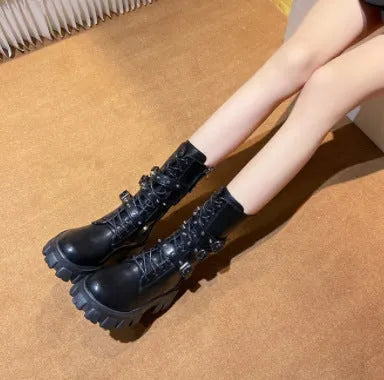 Women's black mid-calf knight boots with a metal buckle strap and side zipper on a round toe.