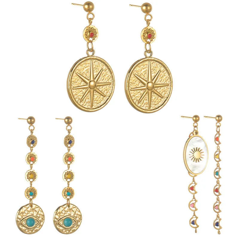 Stainless steel geometric earrings showing eight-awn star, eye and shell sun pattern options