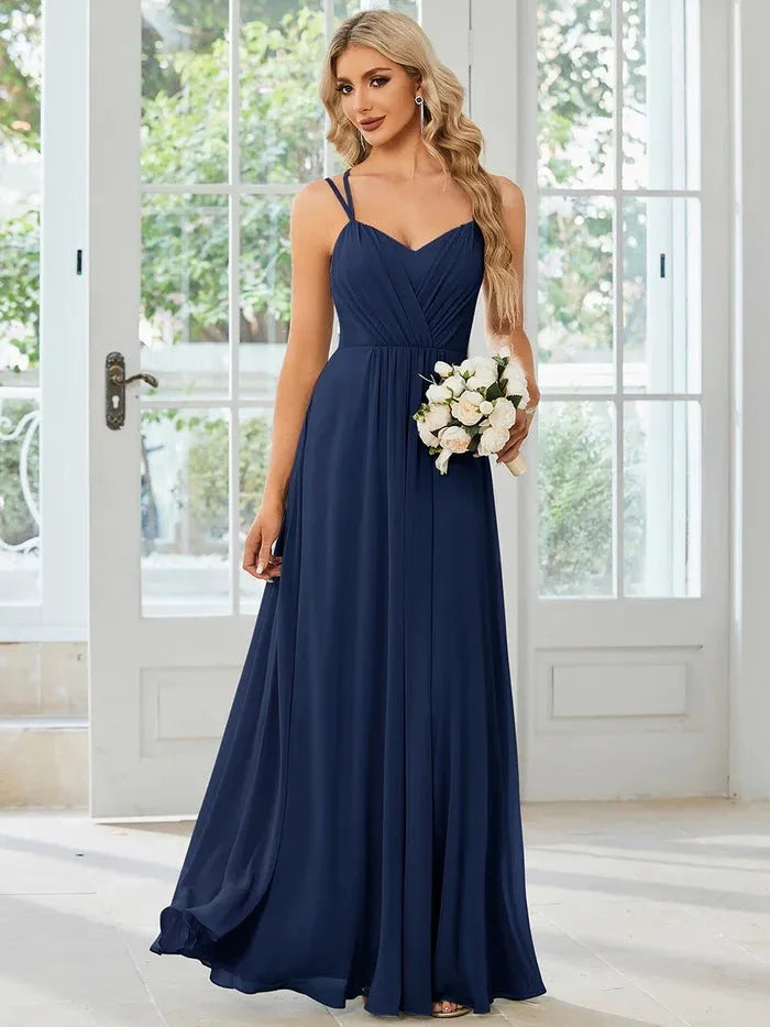 Women's long sleeveless A-line dress with pleated skirt and sling neckline in light green colour