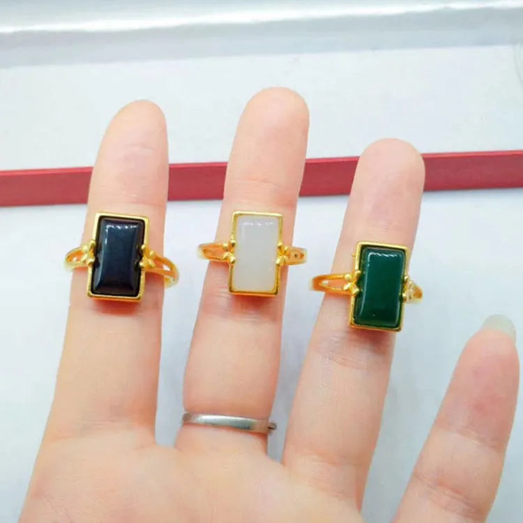 Adjustable brass electroplated ring with gold plating and embedded gemstones in black, green or white options