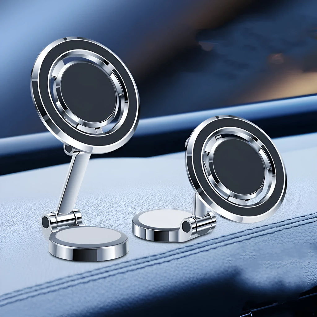 Black car phone holder with magnetic clip fixation mounted on instrument panel showing 360-degree rotation