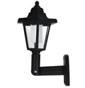 Black hexagonal solar wall lamp with solar panel and LED light for outdoor installation