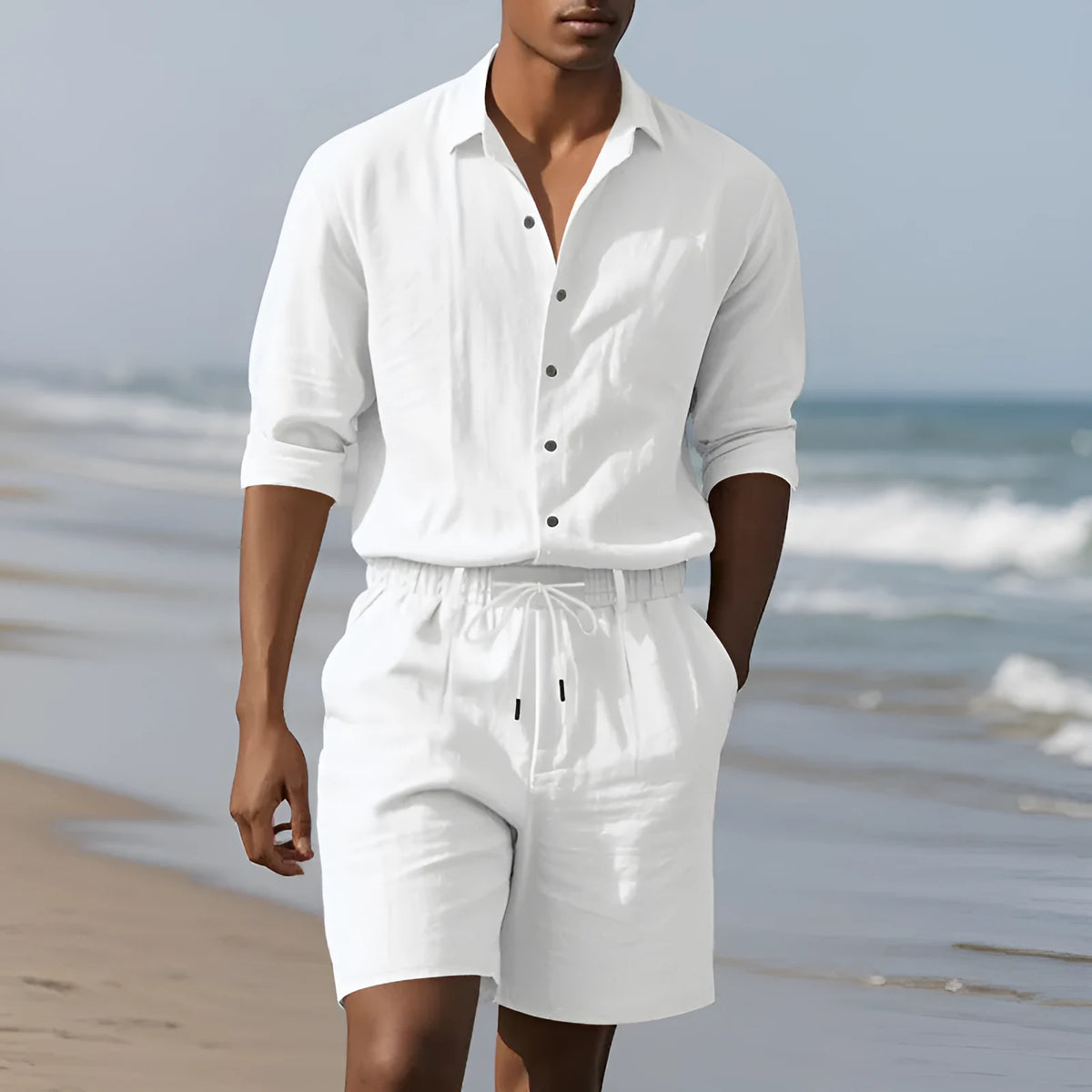 Linen beach suit set showing long sleeve shirt and matching shorts in light blue colour