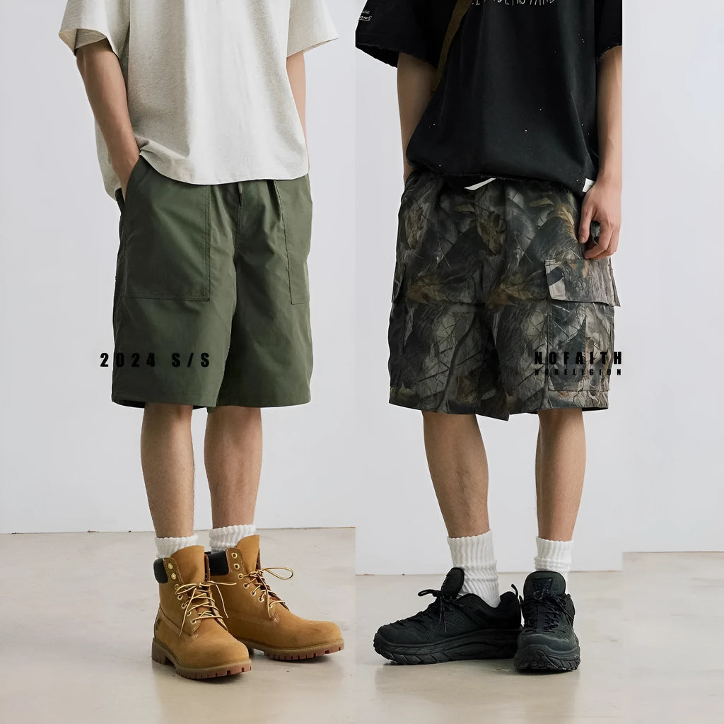 Loose fit straight-leg denim shorts in black shown on a hanger.