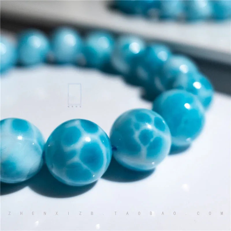 Handcrafted Bodhi bead bracelet with natural crystal sea-pattern stones and pearl accents in Maillard style