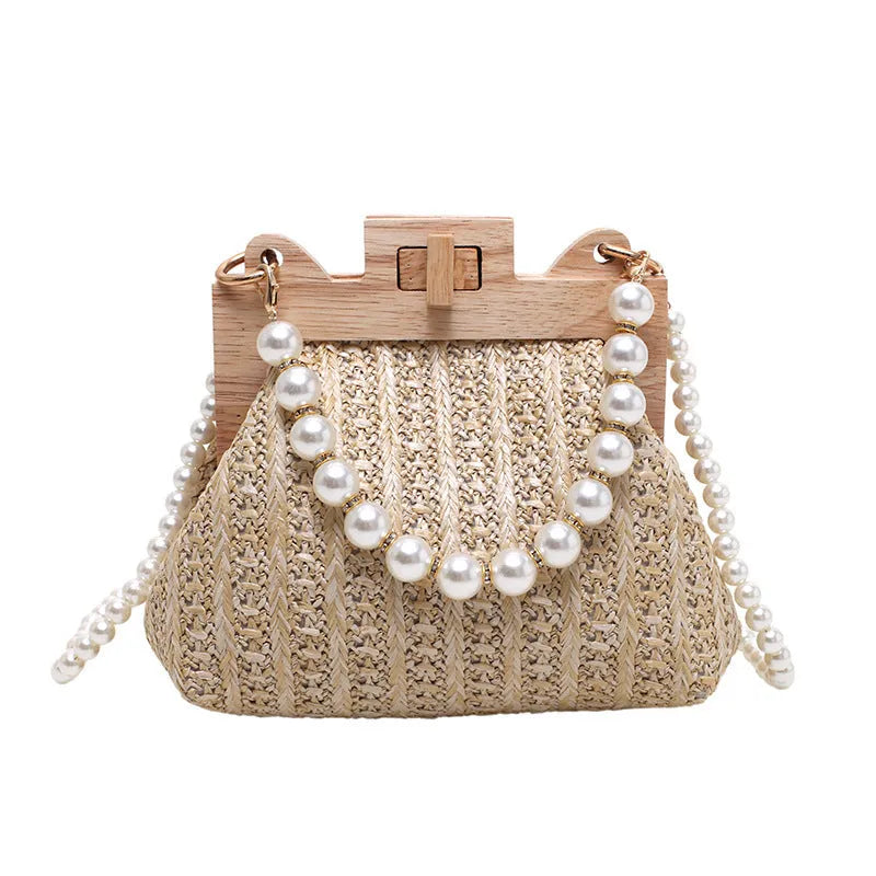 Women's woven straw beach bag with pearl chain shoulder strap in horizontal square shape