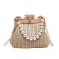 Women's woven straw beach bag with pearl chain shoulder strap in horizontal square shape