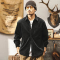 Men's black corduroy shirt jacket with long sleeves and loose retro fit shown unbuttoned