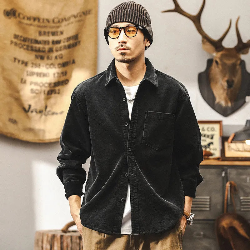 Men's black corduroy shirt jacket with long sleeves and loose retro fit shown unbuttoned