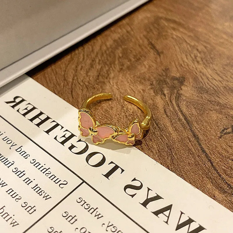 Copper butterfly women's ring with open loop design and Chinese-inspired creative jewellery details