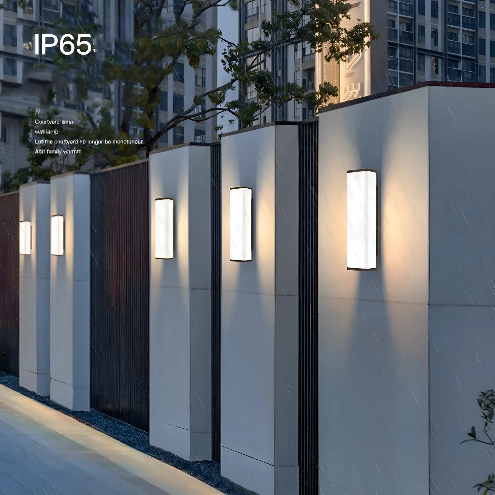 Long, slim stainless steel and plastic outdoor wall light mounted on a brick wall.