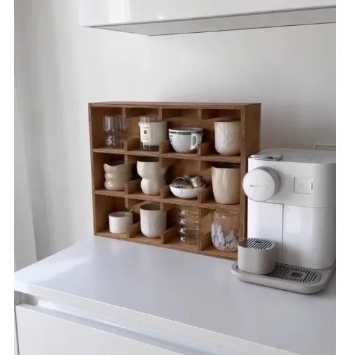 Solid birch wood multi-grid cup storage rack in meridian colour on a kitchen counter.