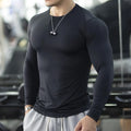 Men's slim-fit fitness tights with long sleeves in black colour for running and gym workouts